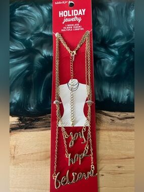 Hilde & Jo Goldtone multi length necklace featuring ‘joy ‘hope ‘believe script